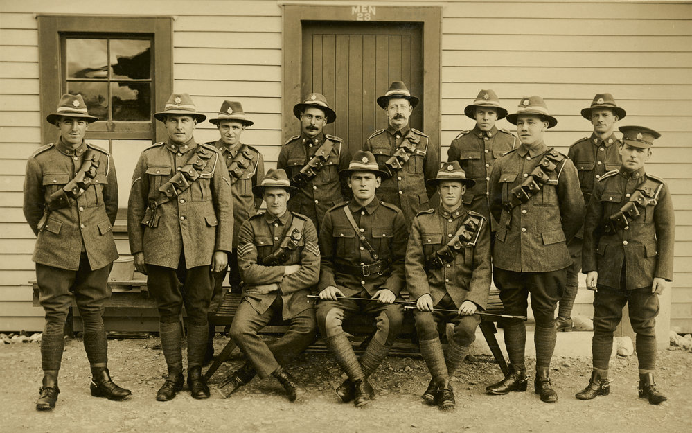 Soldiers in uniform outside barracks