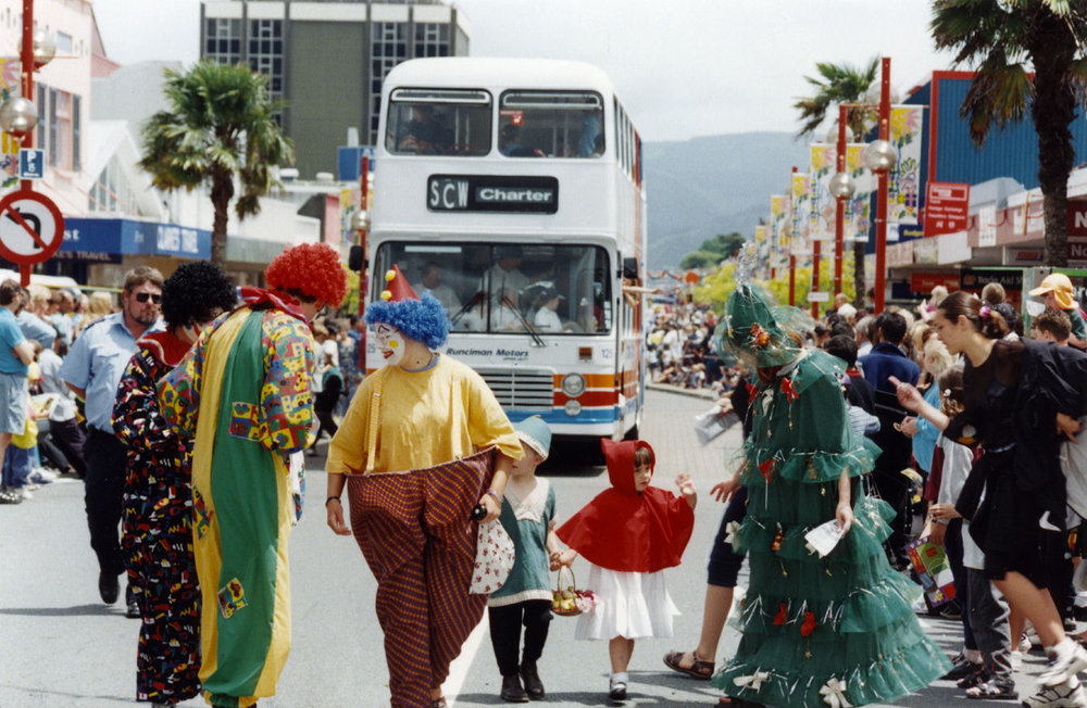 Christmas parade 1998; clowns, double-decker bus