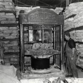 Dunlop raw materials; rubber bales being cut into smaller pieces