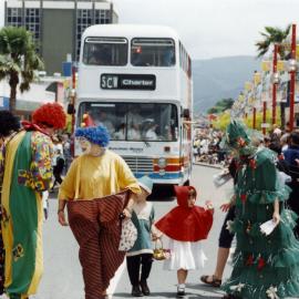 Christmas parade 1998; clowns, double-decker bus