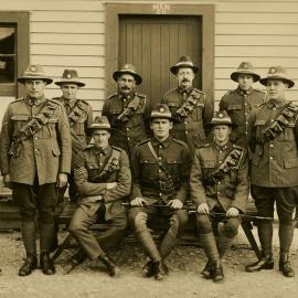 Soldiers in uniform outside barracks