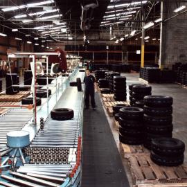 Dunlop finished tyres; sorting conveyor, viewed from the inspection platform